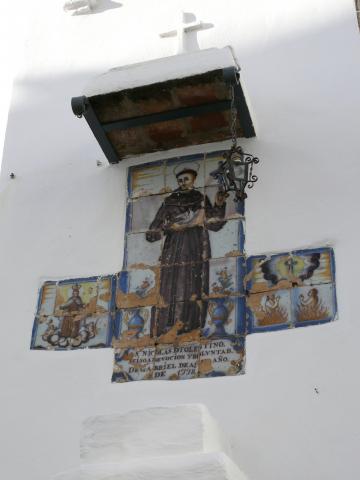 image Azulejos decorados con la imagen de un santo en la fachada de un edificio, Cazalla de la Sierra, Sevilla
