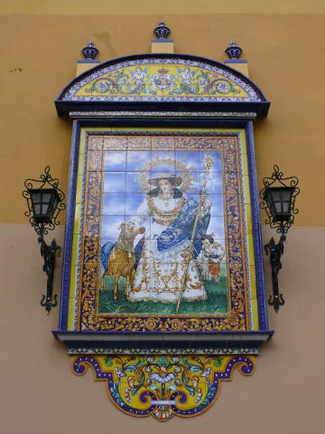 image Azulejos pintados con la imagen de una santa en la fachada de la Iglesia de Santa Ana, Triana, Sevilla