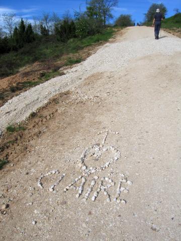image Piedras formando un nombre en el suelo, paisaje del Camino de Santiago entre Villafranca Montes de Oca y San Juan de Ortega, Burgos