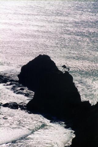 image Cabo Reinga a contraluz, Nueva Zelanda