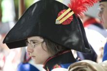 image Recreación de la Guerra de la Independencia en Segovia: Primer plano de un niño vestido de soldado de la época napoleónica
